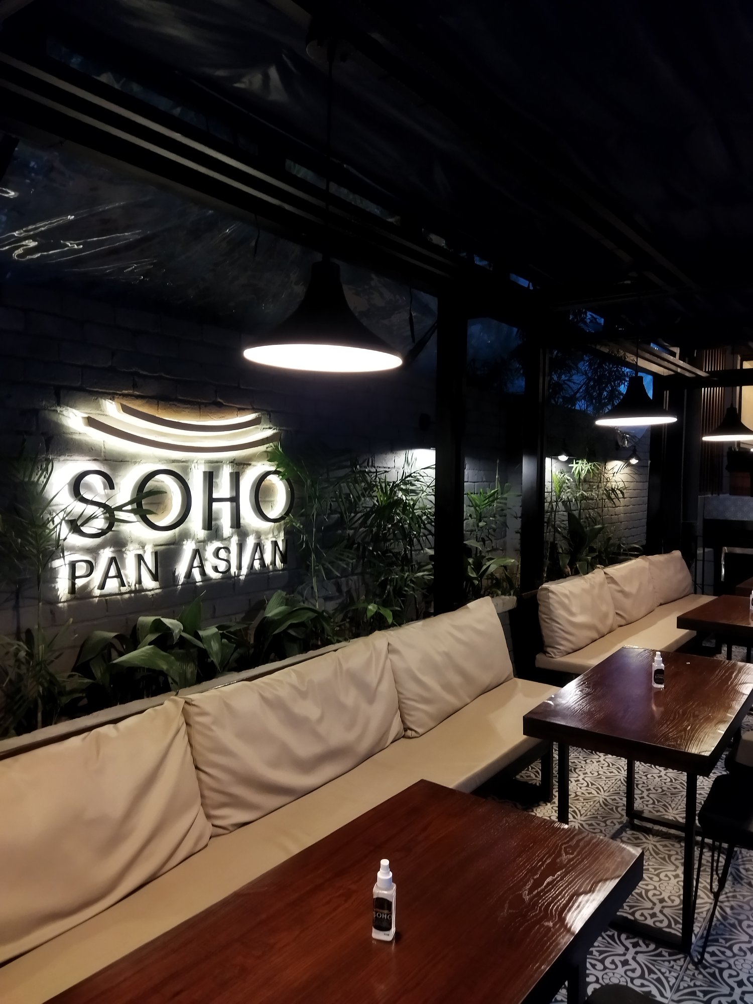 SOHO Pan Asian wall sign and lounge seating
